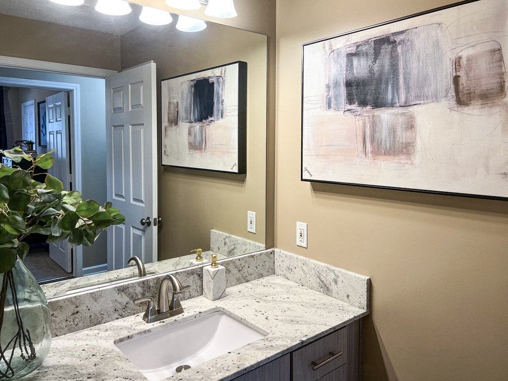 a bathroom with a sink and a mirror at Reserve of Bossier City Apartment Homes in Bossier City, 71111