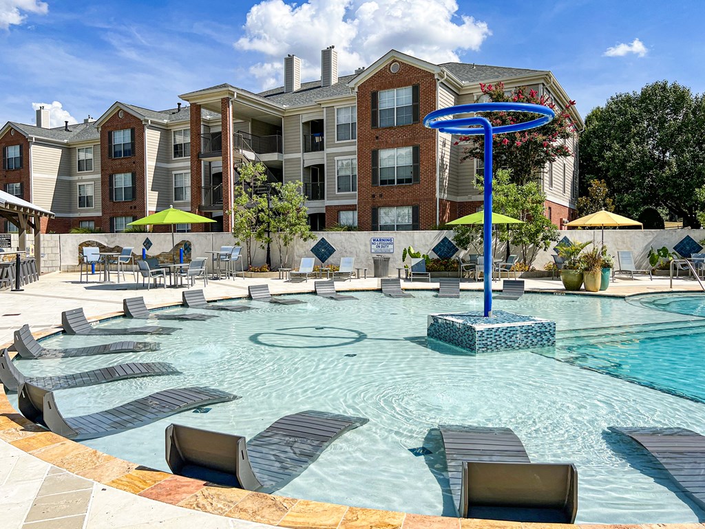 our apartments have a large pool with lounge chairs at Quail Ridge Apartment Homes, Bartlett, TN