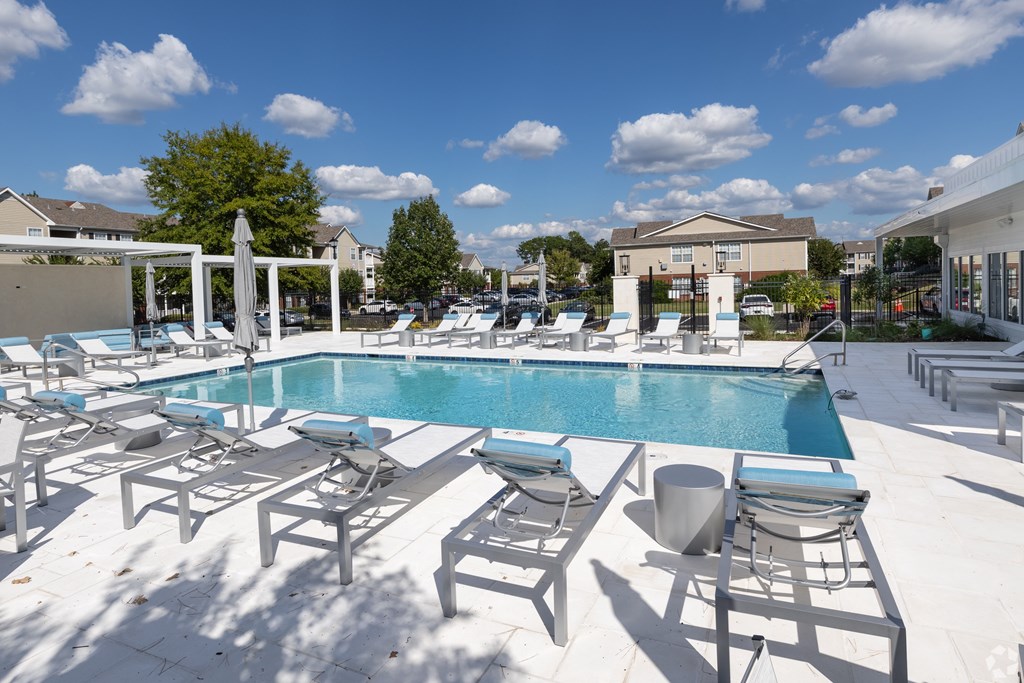 Pool With Relaxing Chairs at Reserve at Park Place Apartment Homes, Hattiesburg, MS, 39402