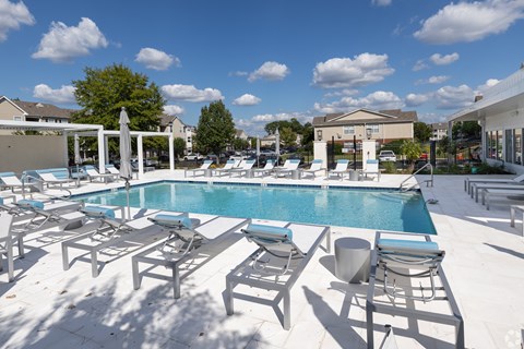 Pool With Relaxing Chairs at Reserve at Park Place Apartment Homes, Hattiesburg, MS, 39402