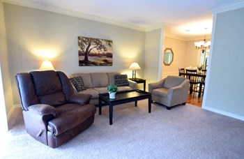 Living Room with Dining Room View Living Room with Dining Room View at The Diplomat of Jackson Apartment Homes, Jackson, MS - Photo Gallery 2