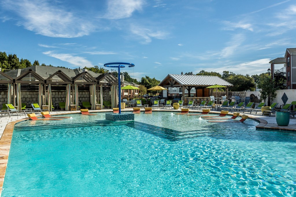 A large swimming pool with a blue tinted water. at Quail Ridge Apartment Homes, Tennessee, 38135