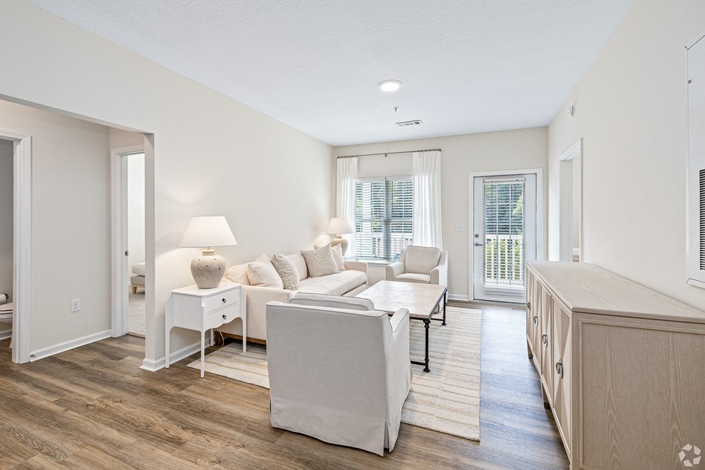 a living room with a couch and a table at The Met Apartment Homes, Mississippi