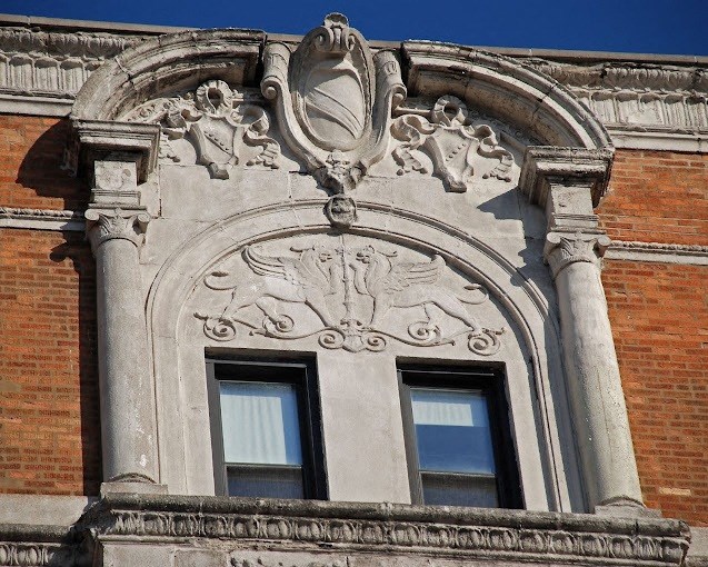 an ornate window on the side of a building