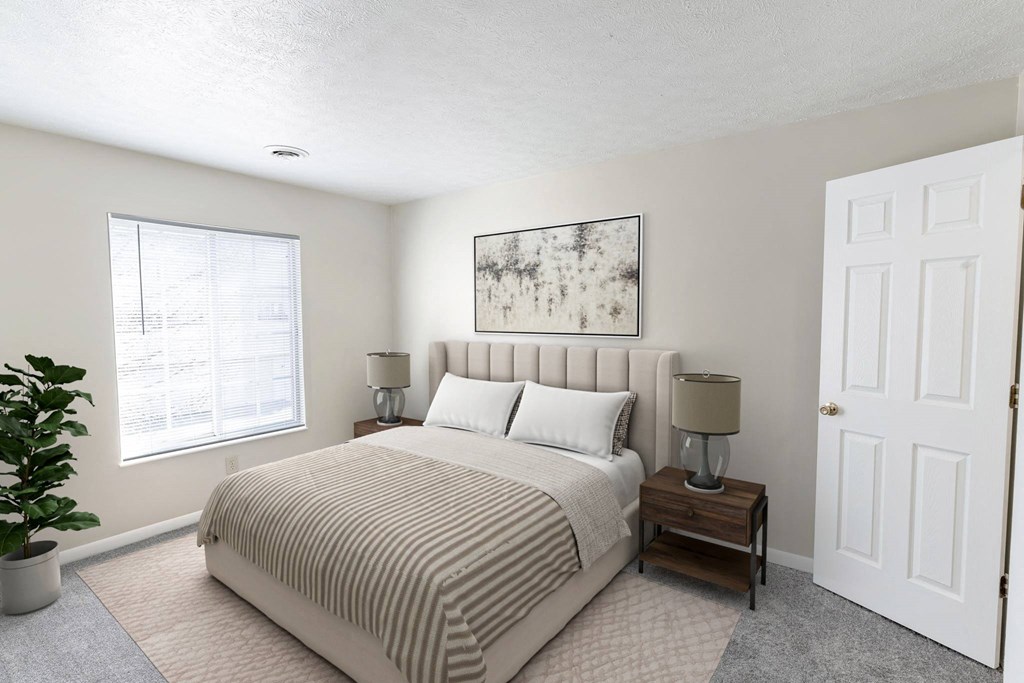 a bedroom with a bed and a window