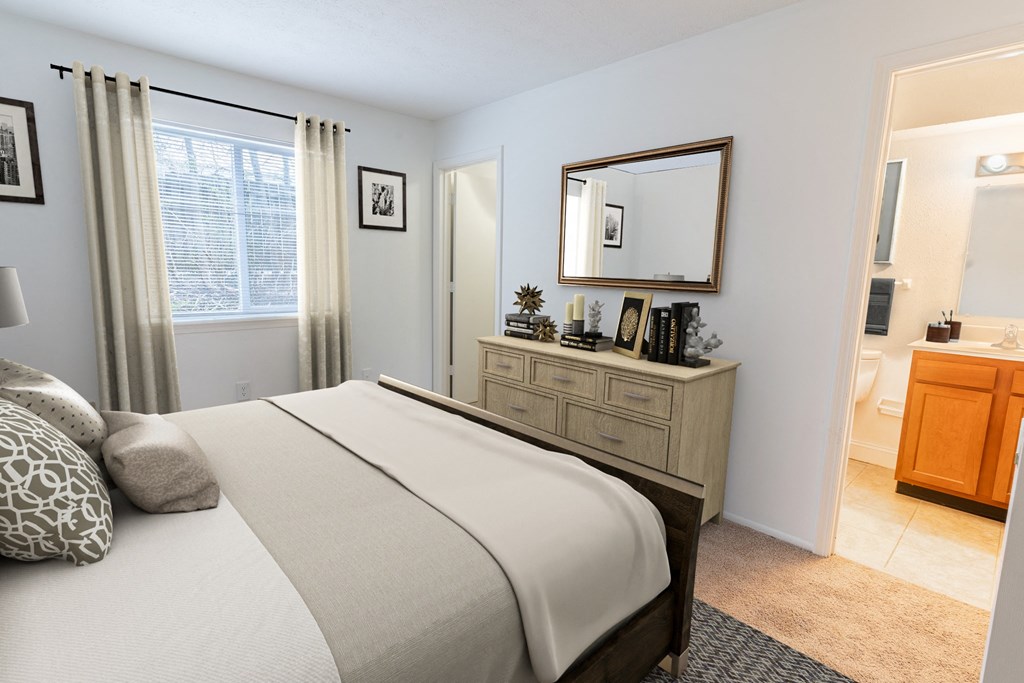 a bedroom with a bed and a dresser with a mirror above it