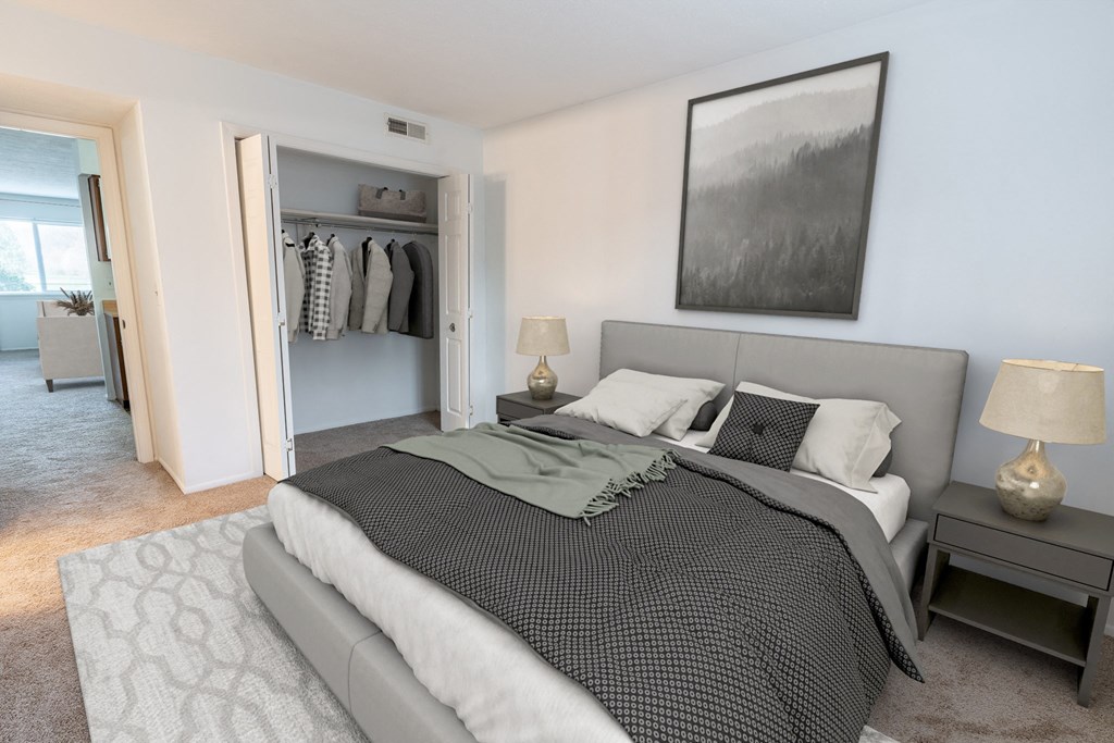 a bedroom with a large bed and a walk in closet