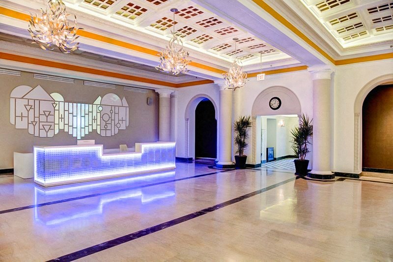 the lobby of a convention hall with a dance floor