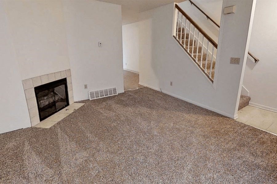 Spacious Living Room with Fireplace at Arbor Pointe Townhomes in Battle Creek, MI