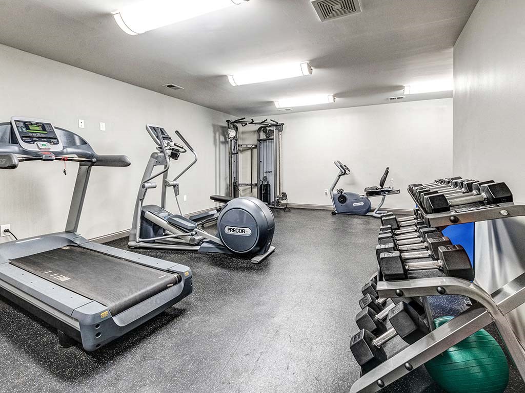 Modern, spacious fitness center with cardio and weightlifting equipment  at HUB of New Albany, New Albany, IN