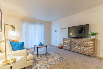Living Room With Oversized Windows And Doors at Crestview at Louisville Apartments, Louisville - Photo Gallery 22