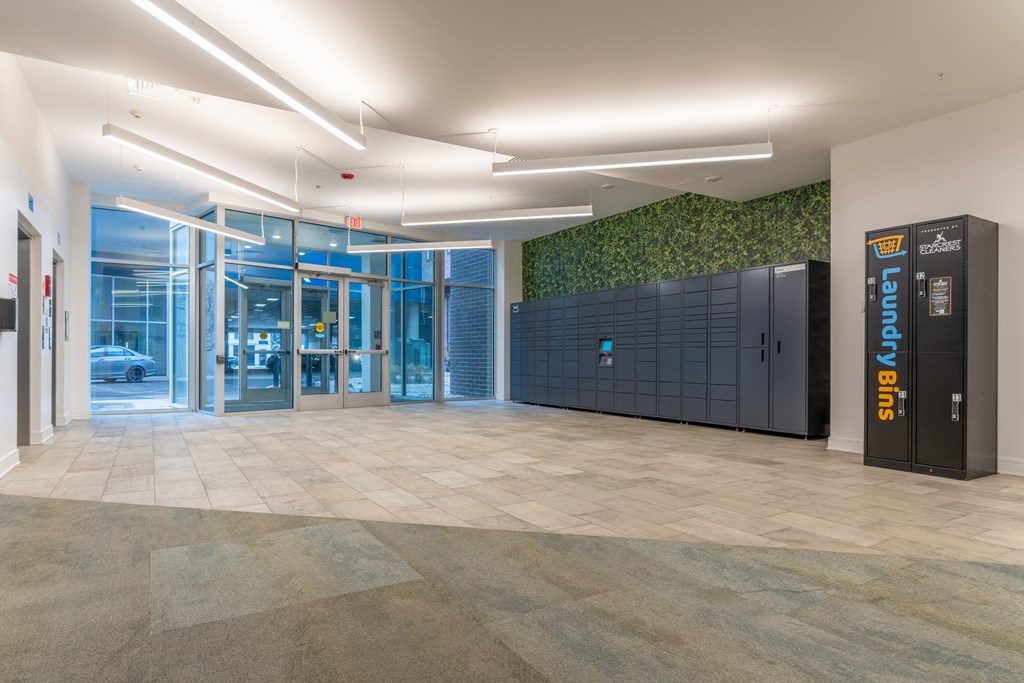 Entrance with Amazon HUB Parcel Lockers at The Whit Apartments, Indianapolis, IN, 46204