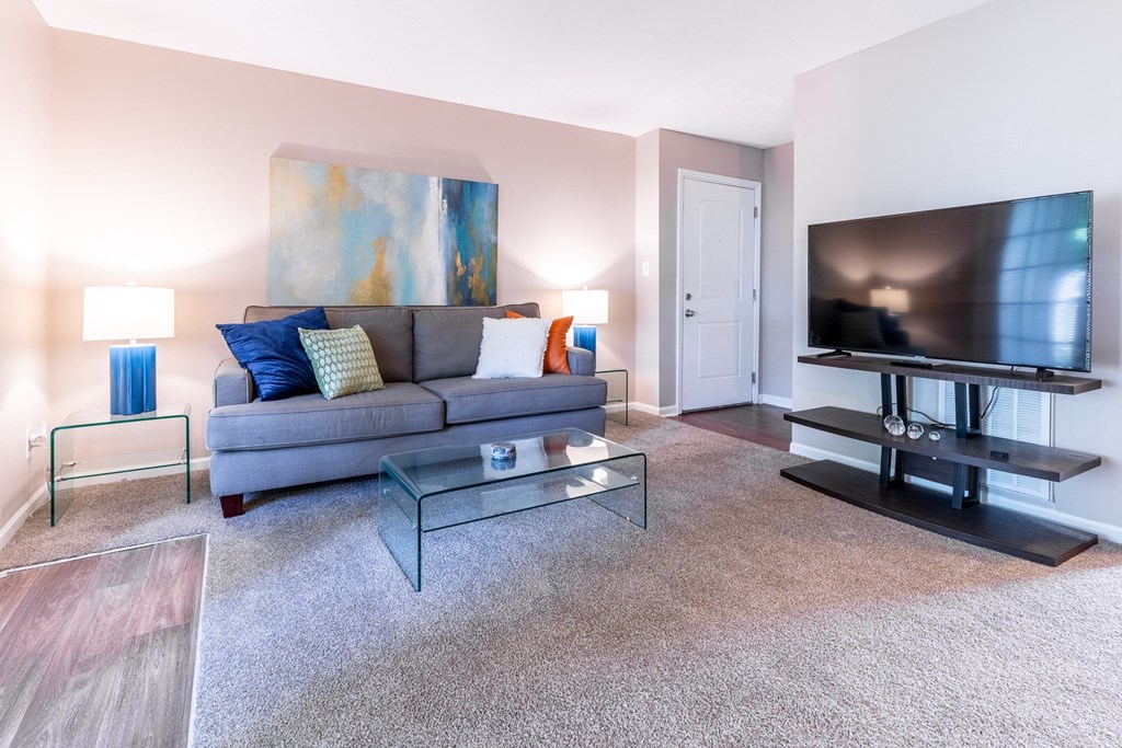 a living room with a couch and a television