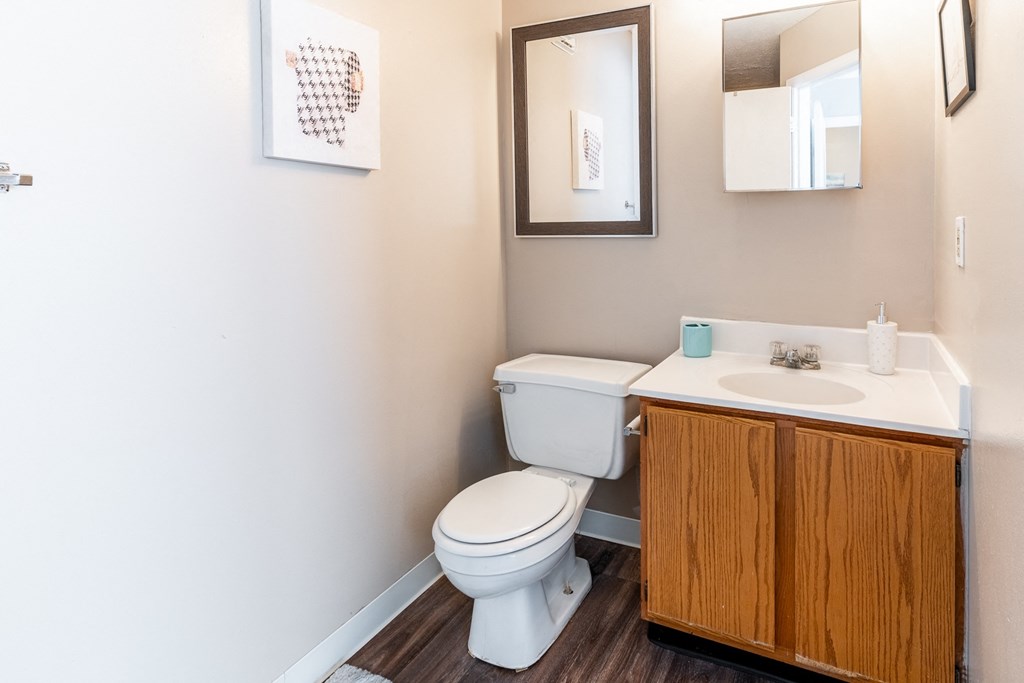 an empty bathroom with a toilet sink and mirror at HUB of New Albany Apartments, Indiana, 47150