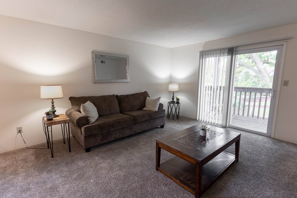 Living Room With Balcony at Candlewyck Apartments, Kalamazoo, MI