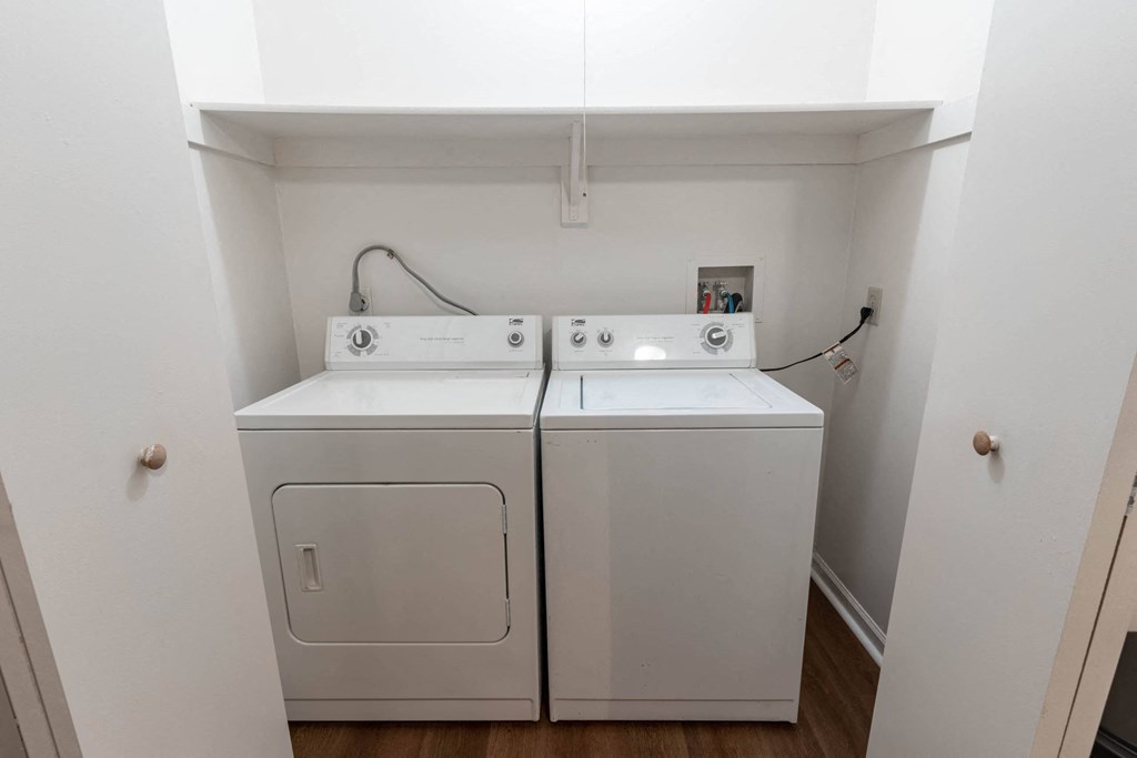 a small laundry room with a washer and dryer