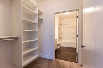 a walk in, custom closet at The Whit Apartments in Indianapolis, IN 46204