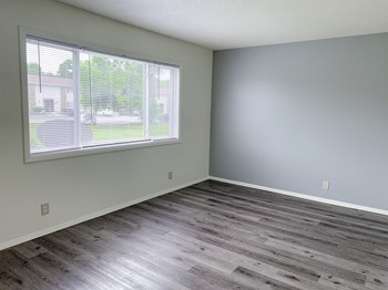 Spacious living room with updated flooring at Fountainview Apartments in Indianapolis, IN - Photo Gallery 3