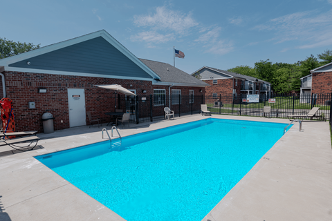 our swimming pool is in front of our building at our apartments in the colony