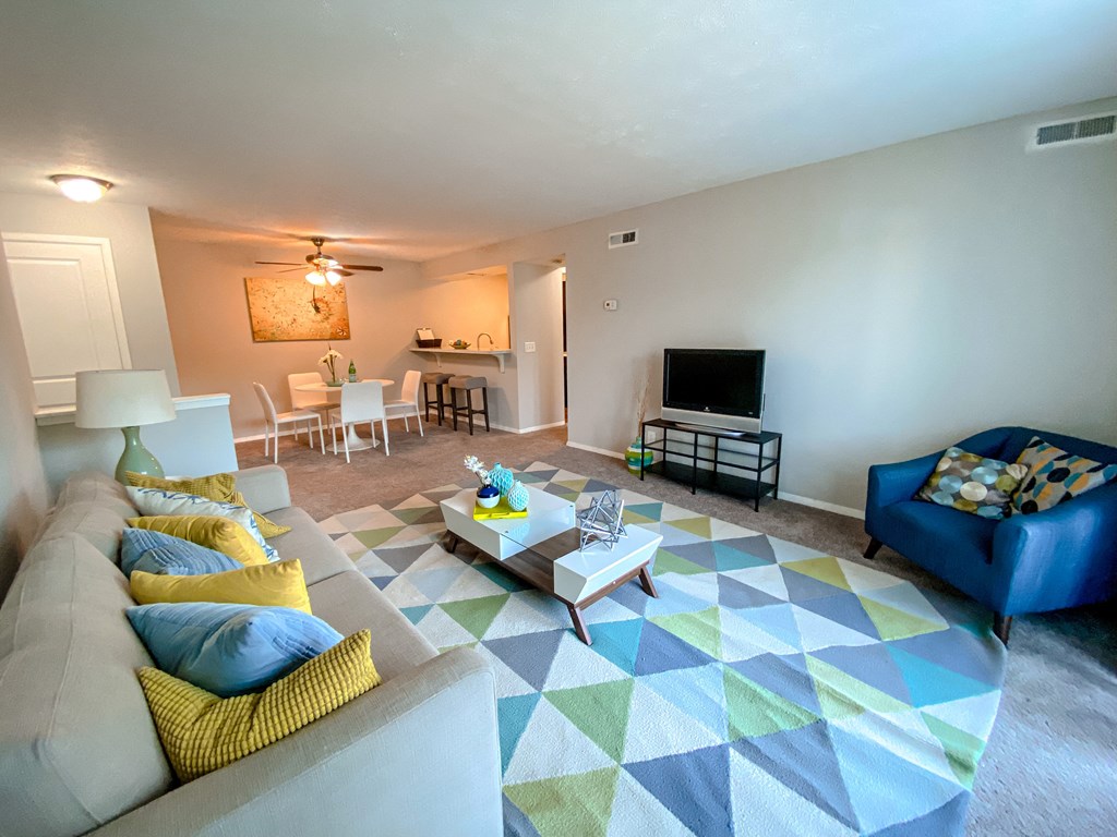 Spacious living room open to the dining room at Camelot East Apartments, Fairfield, 45014