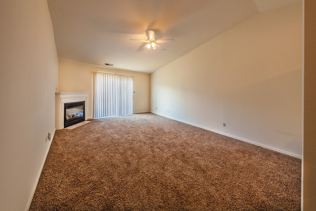 Spacious living room with gas fireplace at Barton Farms in Greenwood, IN 46143
