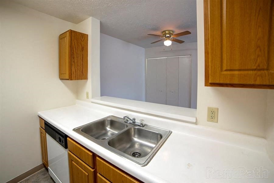 Stainless Steel Sink With Faucet at Creekside Square Apartments, Indianapolis