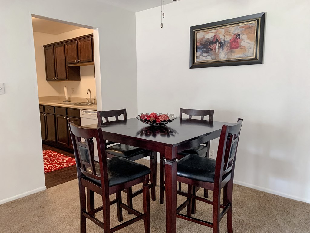 Spacious dining room open to the living room Spacious dining room open to the living room at The Lodge Apartments in Indianapolis, IN