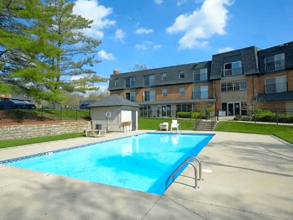 Large, sparkling outdoor pool at Olde Towne Apartments in Middletown, OH