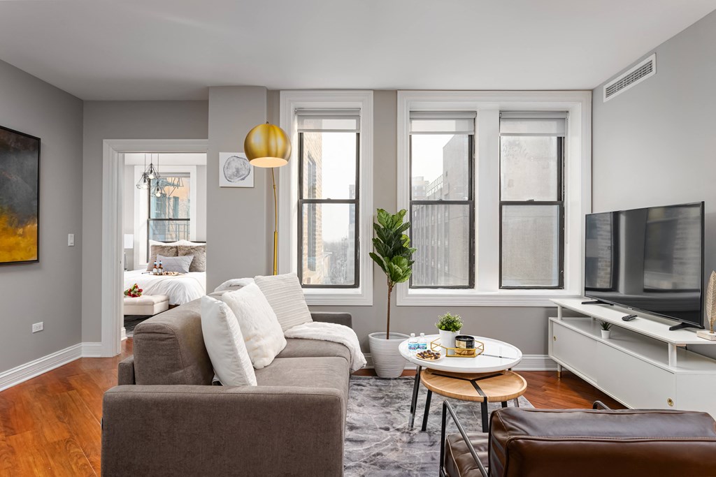 a living room with a couch and a tv