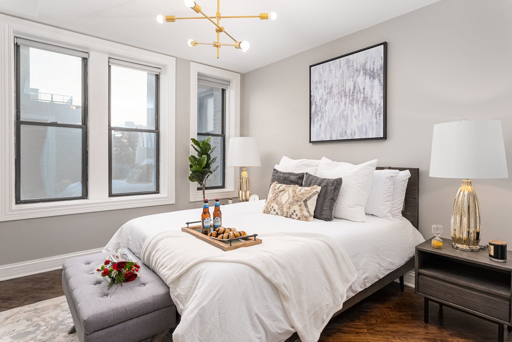 a bedroom with a large bed and a window