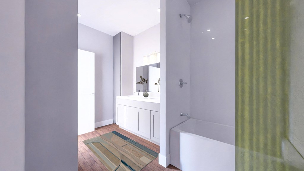 a bathroom with a shower and a sink and a bath tub