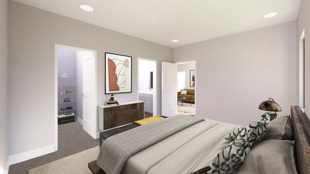 a bedroom with a bed and a dresser and a bathroom