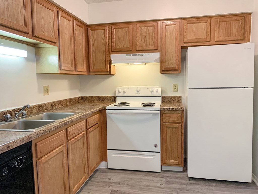 Modern kitchen with faux plank flooring at Waterstone Place Apartments, Indianapolis, IN