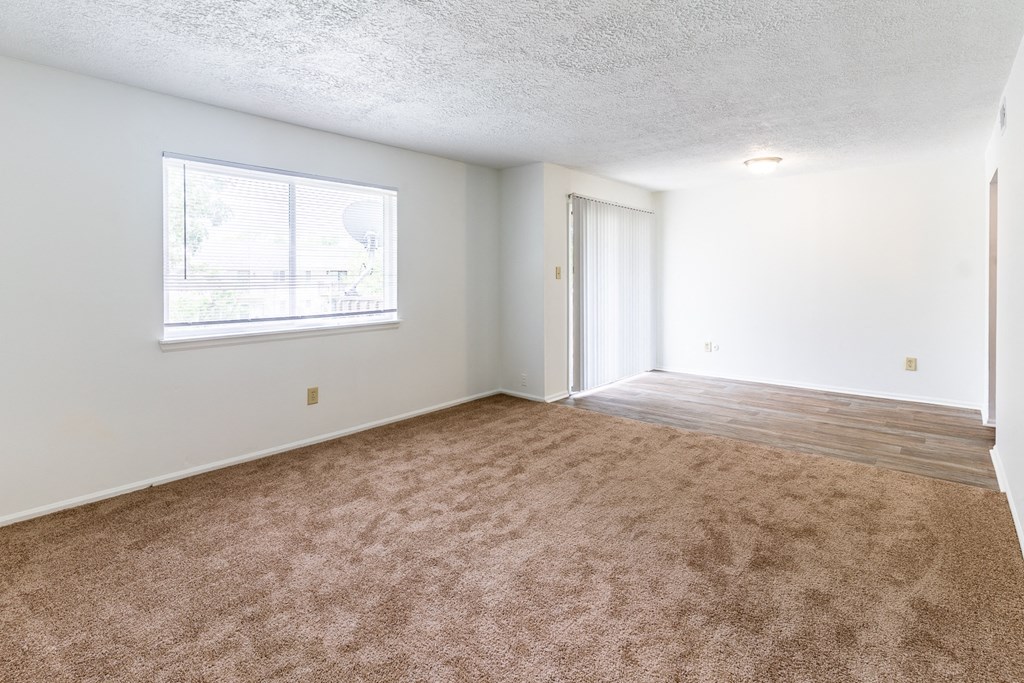 an empty living room at Lake Camelot Apartments, Indiana