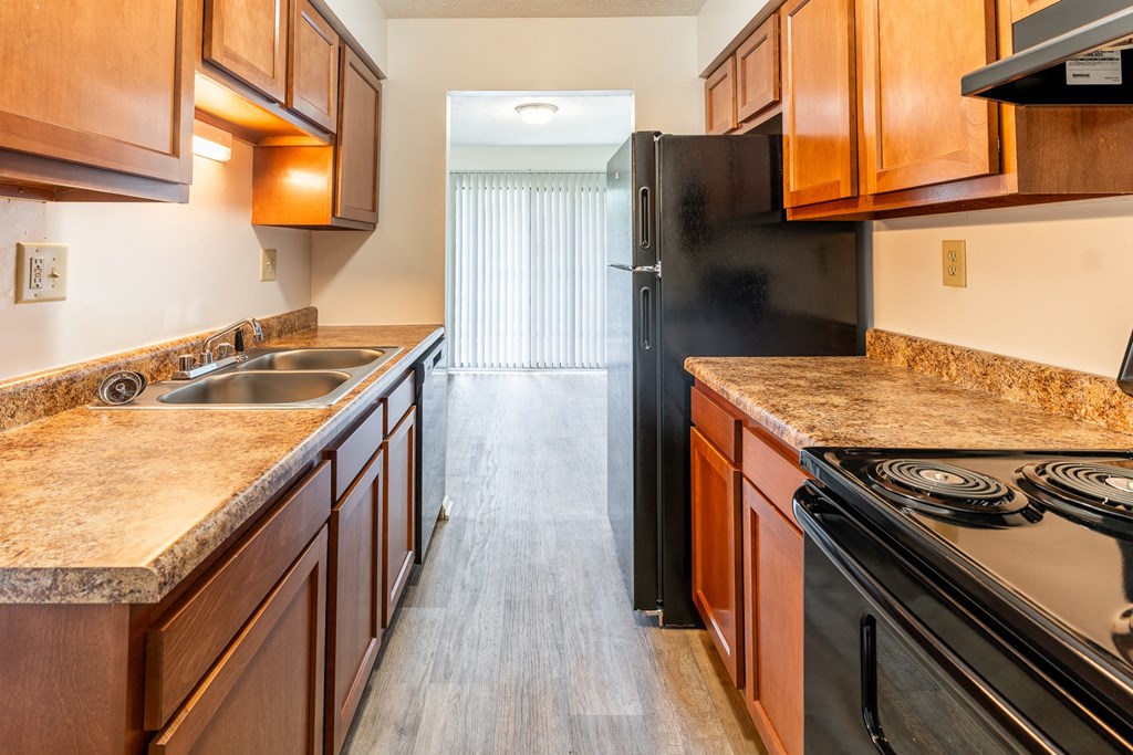 a kitchen with woo at Lake Camelot Apartments, Indianapolis, 46268