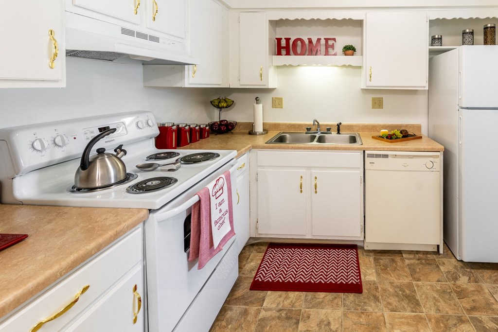 a kitchen with white appliances and white cabinets at Lake Camelot Apartments, Indianapolis, 46268