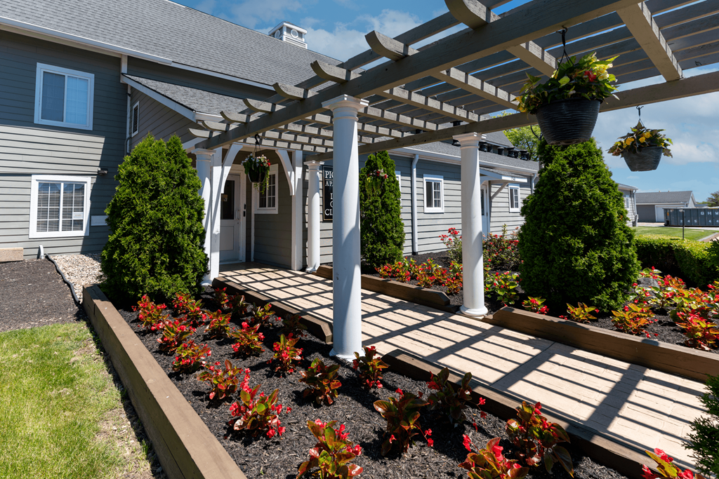 the front yard of a house with a porch and a pergola  at Pickwick Farms Apartments, Indianapolis, IN, 46260