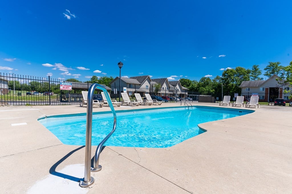 the swimming pool at the estates apartments