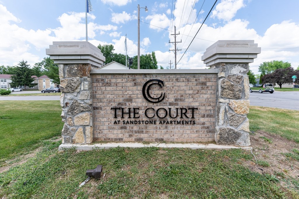 Entrance Signage at The Court at Sandstone Apartments, Greenwood, IN, 46142