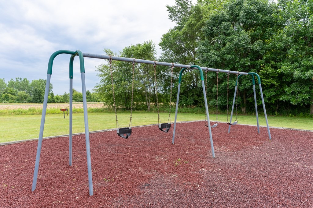 a swing set at a park at Walnut Creek Apartments, Kokomo, IN