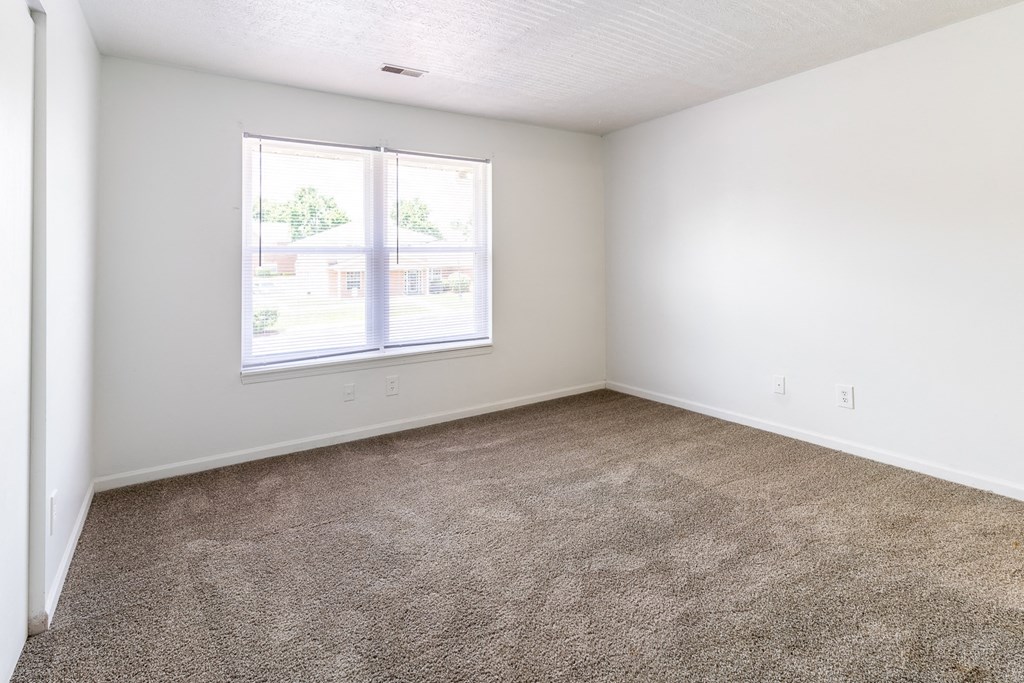 Carpeted Bedroom at HUB of New Albany Apartments, New Albany