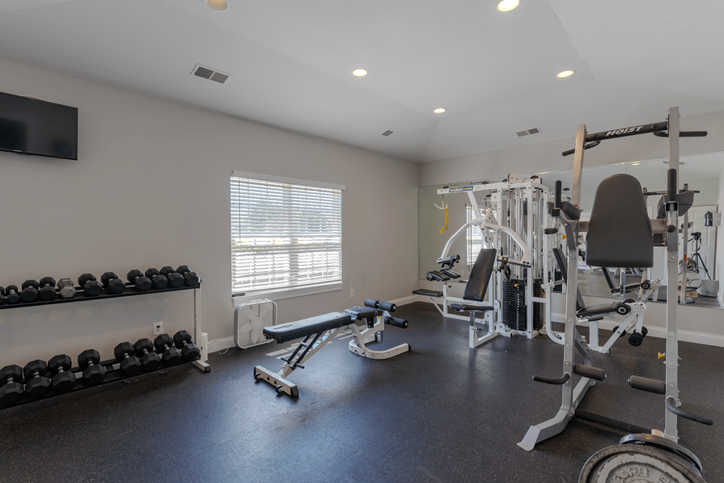 gym with weights and cardio equipment at the preserve at great neck apartments at Barton Farms in Greenwood, IN 46143