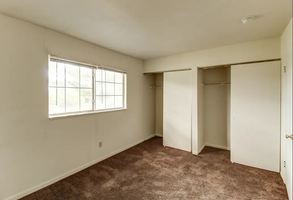 Vacant Bedroom with large closets at Arbor Pointe Townhomes, Battle Creek, Michigan