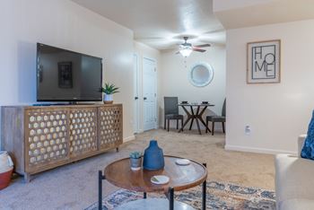 Open spacious living and dining room with ceiling fan at Crestview at Louisville Apartments in Louisville, Kentucky 40217