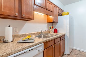 Fully equipped kitchen with refrigerator at Crestview at Louisville Apartments in Louisville, Kentucky 40217