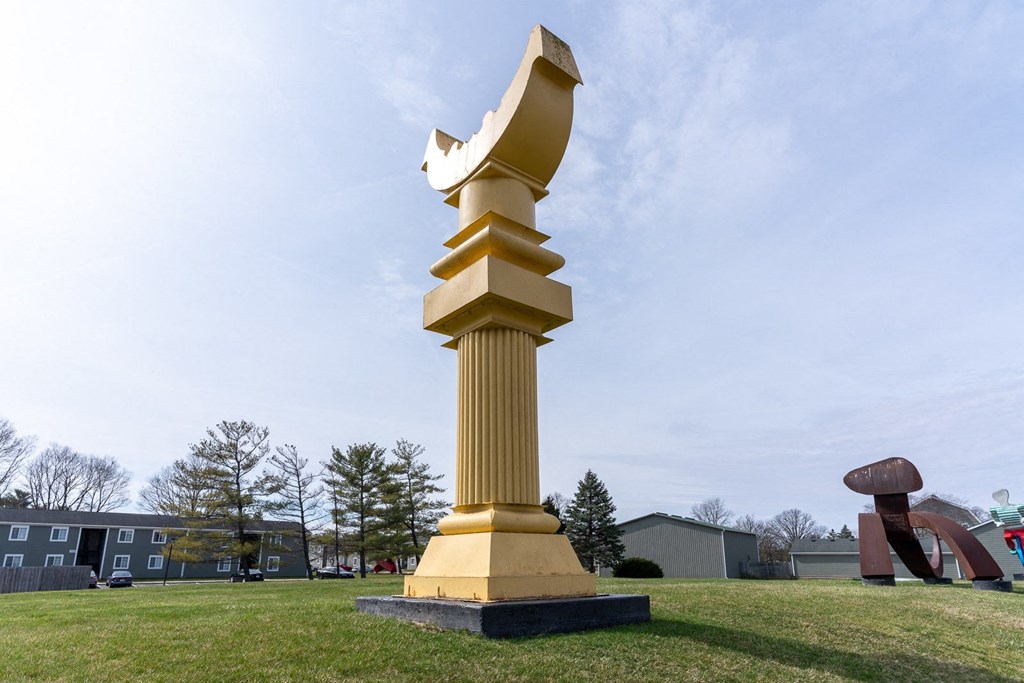 a large statue of a golden bird at Pickwick Farms Apartments, Indiana