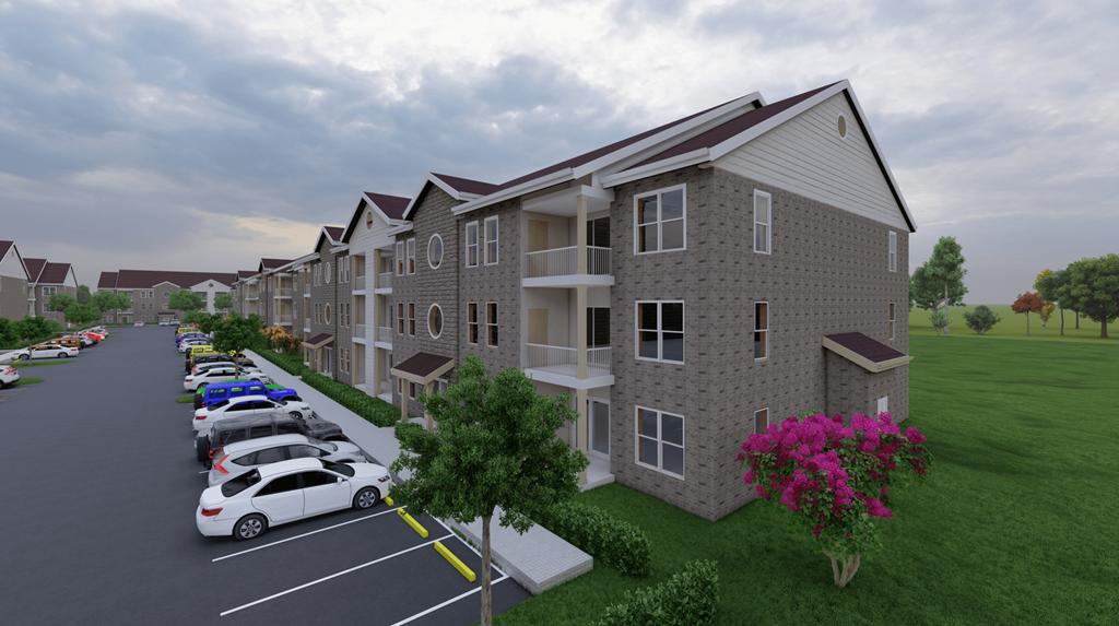 an aerial view of an apartment building with cars parked in a parking lot