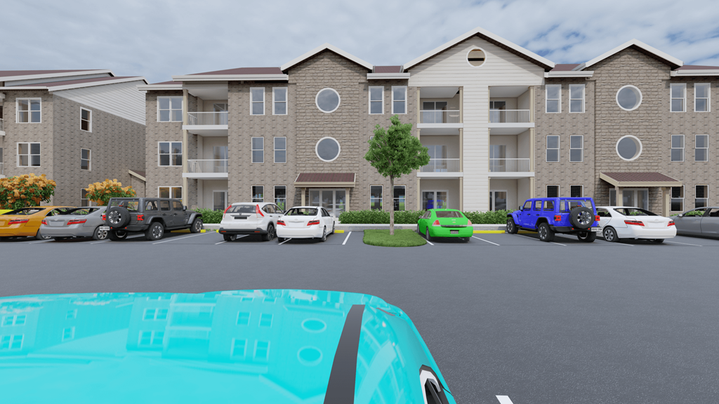 a parking lot with cars in front of an apartment building