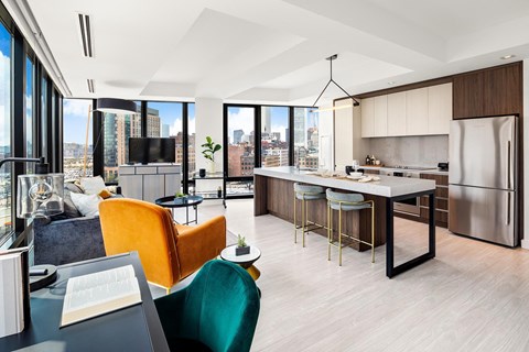 A modern kitchen with a dining table and chairs.