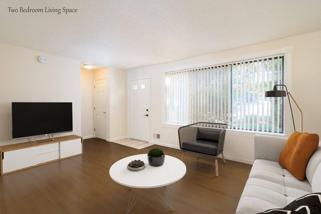 a living room with a couch and a table and a television